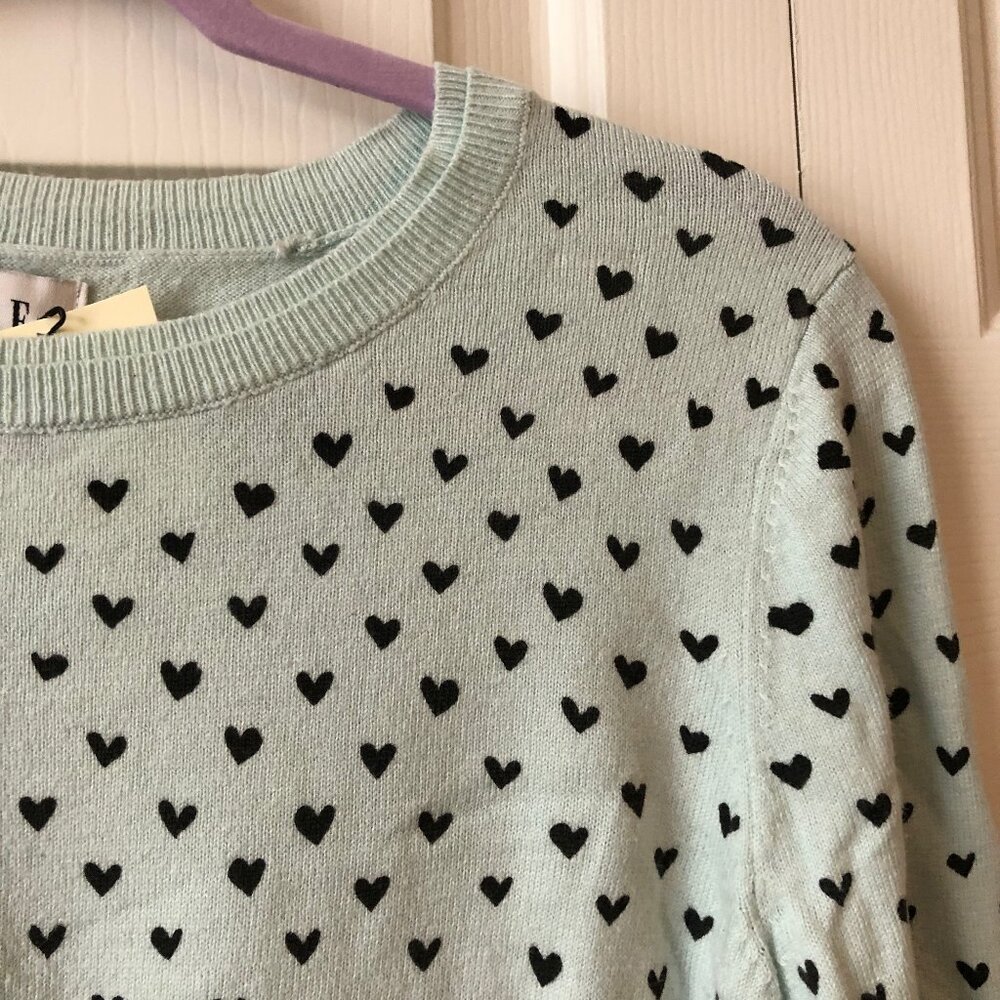 Light blue sweater dotted with hearts